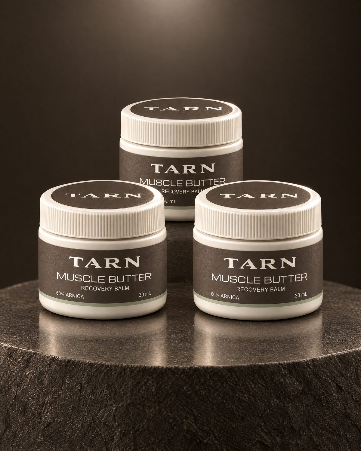 TARN Muscle Butter, three 30 mL jars on a stone plinth