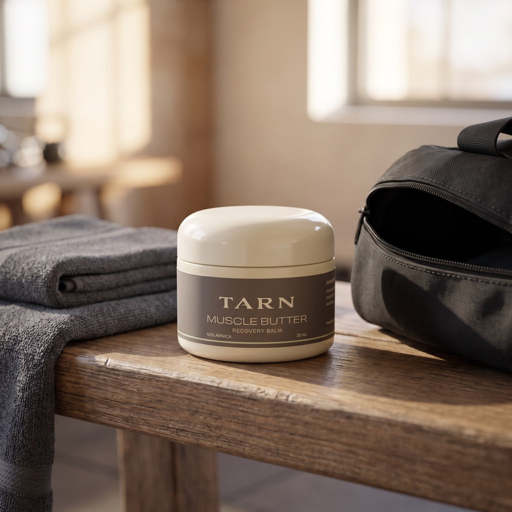 TARN Muscle Butter on a gym bench beside a towel and gym bag