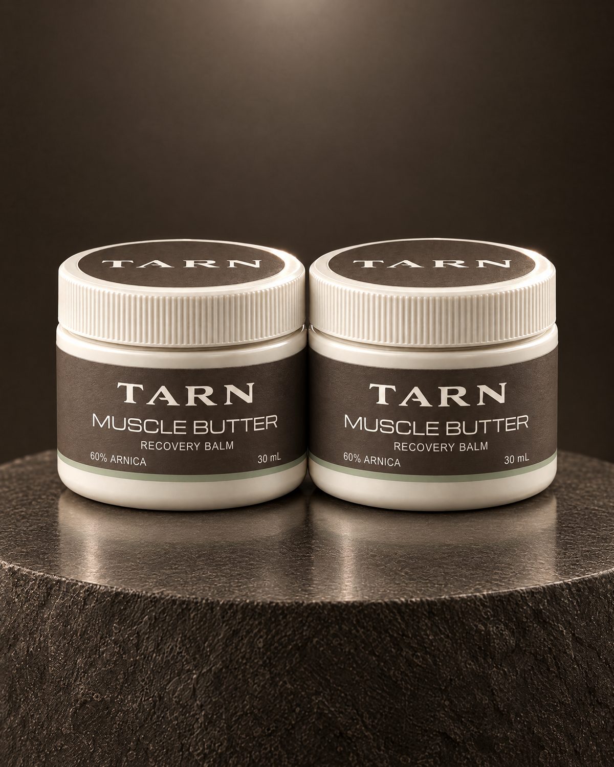 TARN Muscle Butter, two 30 mL jars on a stone plinth